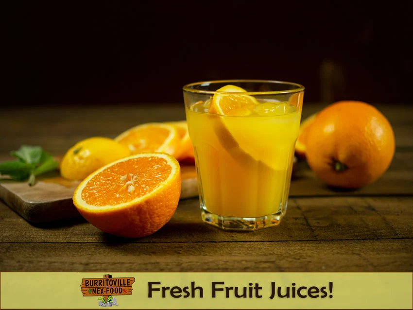 Burritoville Mex Food - Fresh Fruit Juices - Glass of orange juice with slices and whole oranges, logo and texts.